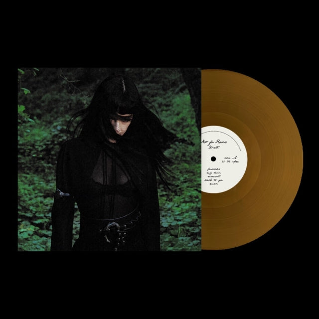 Not For Radio "Melt" album cover featuring a woman in a forest, shown with a gold colored vinyl record