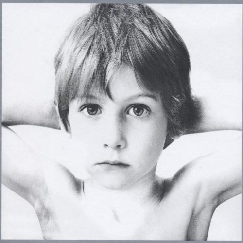 U2 "Boy" album cover featuring a Black and white photo of a child with a neutral expression