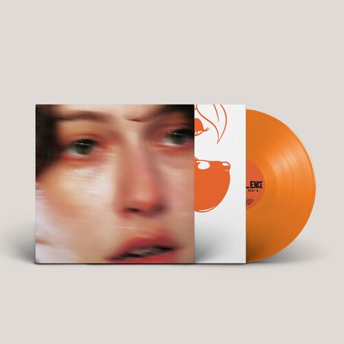 King Princess "Girl Violence" album cover featuring a close-up of their face, shown with an orange colored vinyl record