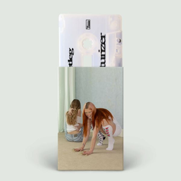 Wet Leg "moisturizer" cassette album cover shown with an ice white colored cassette tape sticking out from the top of the cover