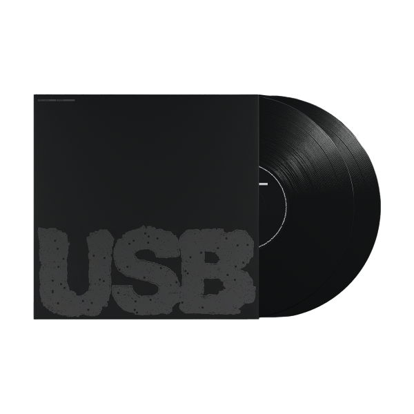 Fred Again "USB002" album cover, featuring a solid black background with "USB" written in dark grey letters, shown with 2 black vinyl records