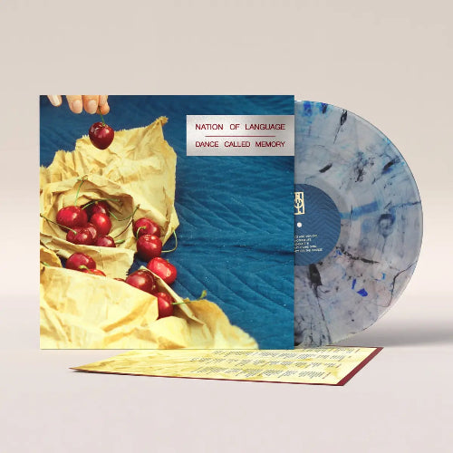 Nation of Language - Dance Called Memory album cover and clear w/ blue and black splatter vinyl.