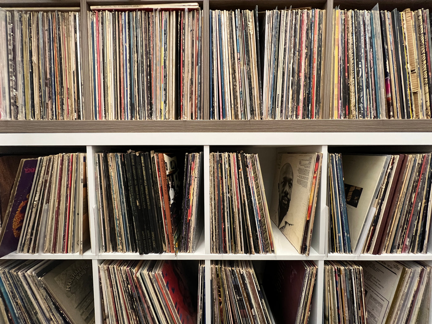 Image of Ikea record shelves with collection of records stored vertically inside each shelf.