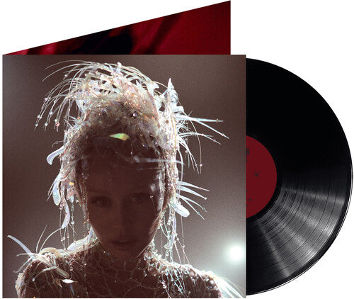 Miley Cyrus - Something Beautiful album cover and a vinyl record
