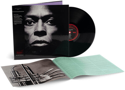 Miles Davis - Tutu album cover, black vinyl, and insert.