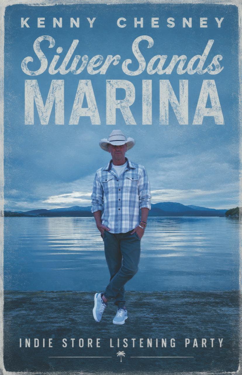 Image of Kenny Chesney standing next to a body of water with blue tinted mountains in the background and white text above him that reads Kenny Chesney Silver Sands Marina. Text below that reads Indie Store Listening Party.