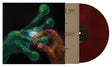 Brick colored vinyl record with a colorful cover featuring hands and a large diamond ring.