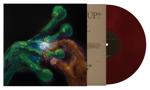 Brick colored vinyl record with a colorful cover featuring hands and a large diamond ring.