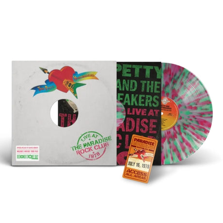 Tom Petty Live at Paradise Rock Club album cover, shown with a printed inner sleeve, pink & green splatter vinyl, and replica of a vintage tour pass