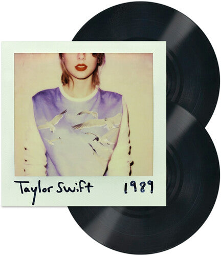 Image of two black vinyl records with a Polaroid-style image of Taylor Swift and '1989' text.