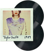 Image of two black vinyl records with a Polaroid-style image of Taylor Swift and '1989' text.