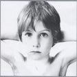 U2 "Boy" album cover featuring a Black and white photo of a child with a neutral expression