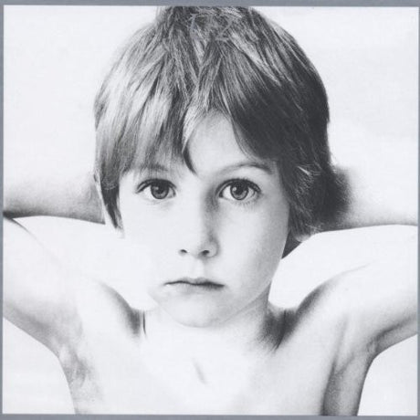 U2 "Boy" album cover featuring a Black and white photo of a child with a neutral expression