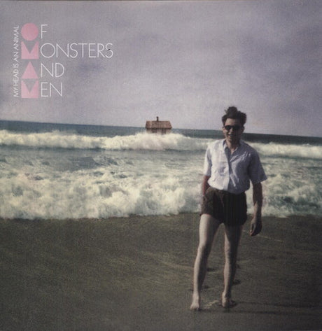 Album cover with a person on a beach and text 'Of Monsters and Men' at the top.