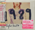 Album cover for Taylor Swift's '1989' with a person wearing a shirt with '1989' printed on it. With a Japanese obi strip and hype sticker