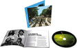 The Beatles - Abbey Road Anniversary CD cover, inner booklet and CD with a green apple printed on it shown on a white background