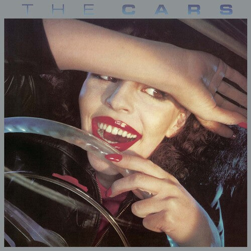 The Cars self-titled album cover with a person holding a steering wheel, featuring the text 'The Cars'.