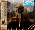 Taylor Swift "Evermore" album cover featuring Taylor with braided hair in a forest setting, and a Japanese obi strip