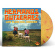 Vinyl record with cover featuring 'Hermanos Gutierrez' and image of people with llamas in a field.