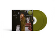 Vinyl record with green sleeves and a cover featuring a image of Carly Rae Jepsen in a coat.