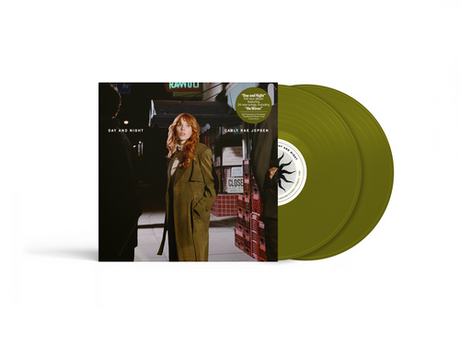 Vinyl record with green sleeves and a cover featuring a image of Carly Rae Jepsen in a coat.