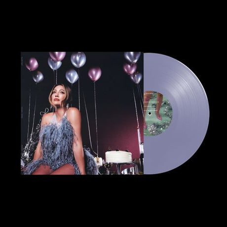 Vinyl album cover for Hilary Duff Holiday Things showing Duff sitting in front of some silver and purple balloons. Purple colored vinyl record sticking out the right side of the sleeve.