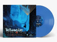 Album cover for The Flaming Lips The Teardrop Throbs with Blue vinyl record sticking out the side of the sleeve against a white background