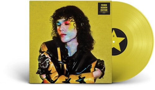 Conan Gray "found heaven" album cover with a yellow cover featuring a person and a star design. shown with a yellow vinyl record