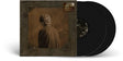 two black vinyl records shown with a brown album cover featuring a person's back
