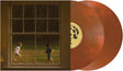 Rust colored vinyl records with a window view of two children playing outside on the album cover