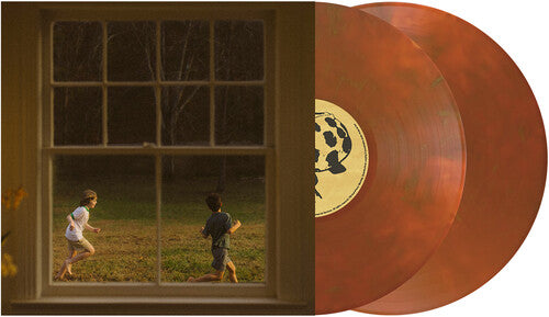 Rust colored vinyl records with a window view of two children playing outside on the album cover