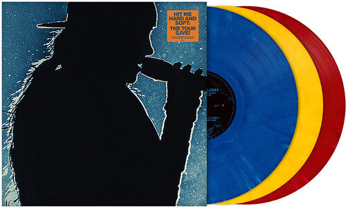 Vinyl records in blue, yellow, and red with Billie Eilish's silhouette on the cover