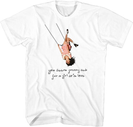 White t-shirt with graphic of a girl on a swing and text, on a white background