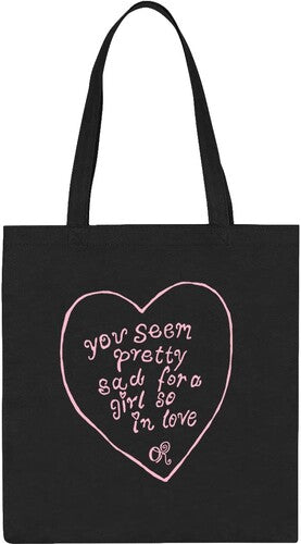 Black tote bag with pink heart-shaped text on a white background