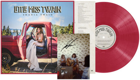 Little Miss Twain Shania Twain vinyl record album package, featuring a red translucent LP, printed cover art with a red pickup truck and woman, an interior track insert page, and a signed photo insert.