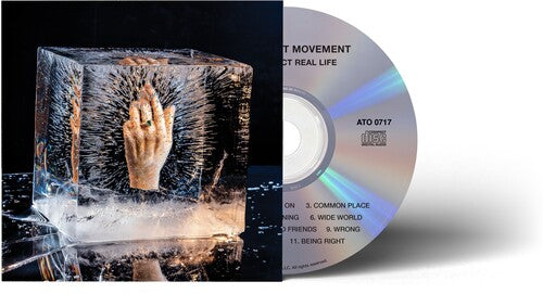 Improvement Movement - Your Perfect Real Life album cover. Part of the CD is also visible, which has the album title and song names printed on it