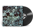 A vinyl record partially pulled from its sleeve, showing the album cover artwork of a metallic skull in icy blue and black tones, with the black LP disc visible behind it on a white background.