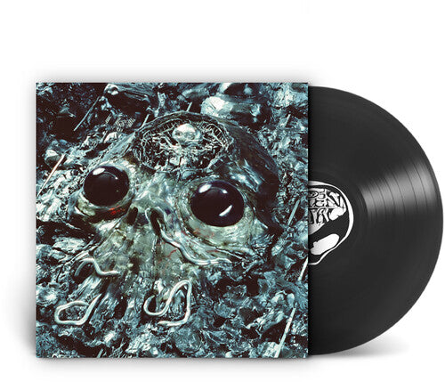 A vinyl record partially pulled from its sleeve, showing the album cover artwork of a metallic skull in icy blue and black tones, with the black LP disc visible behind it on a white background.