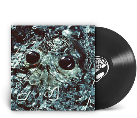 A vinyl record partially pulled from its sleeve, showing the album cover artwork of a metallic skull in icy blue and black tones, with the black LP disc visible behind it on a white background.