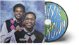 A CD album cover shown with its front cover and a compact disc partially visible out the side of the sleeve. The cover features Cordae and Anderson. Paak in argyle vests against a blue marbled backdrop, with a Parental Advisory label at the bottom. The CD has a cartoon style image of the earth with white text.