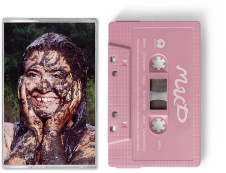 Remi Wolf "Mud" album cover shown with a baby pink cassette tape