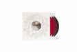 A vinyl record album package on a white background, featuring a cream-colored sleeve with a circular cloudy photo in the center and delicate line art, with three visible records in red, maroon, and black.