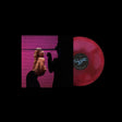 A vinyl record album shown on a black background, featuring a red translucent record partially pulled from its sleeve. The sleeve artwork shows a woman in front of pink horizontal blinds, with a black silhouette of a person beside her pulling down one of the blinds.