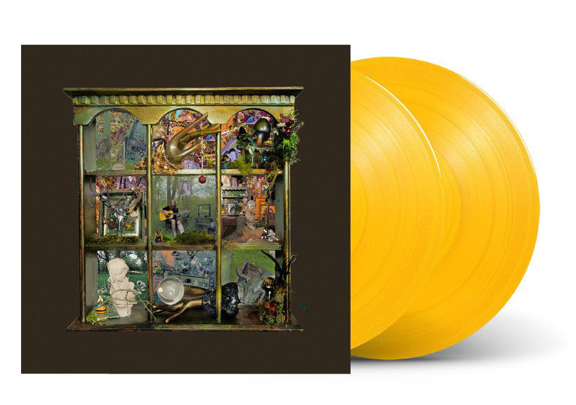 Yellow vinyl record with an ornate cover featuring artistic designs and Billy Strings in the middle.