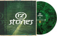 Green vinyl record with '12 stones' branding on a textured green background