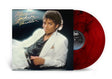 Album cover for Michael Jackson Thriller showing Michael Jackson in a white suit and black shirt laying sideways against a black backdrop with red and black marbled vinyl sticking out of the right side of the sleeve.
