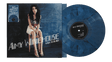 Vinyl album sleeve showing Amy Winehouse sitting on a stool in front of a blue chalkboard with a blue and black record sticking out of the sleeve and "Amy Winehouse Back To Black" text across front of sleeve.