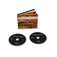 Two black CDs with CD sleeve behind them showing the inner workings of a piano.