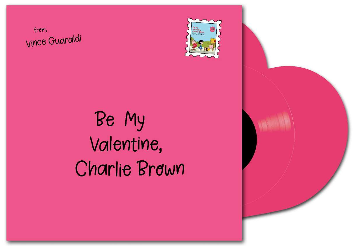 A pink vinyl record album cover with a matching pink record partially visible behind it. The cover reads 'from, Vince Guaraldi' and 'Be My Valentine, Charlie Brown' with a small postage-style stamp graphic in the top right.