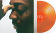 Brent Faiyaz - Icon album cover and orange vinyl 
